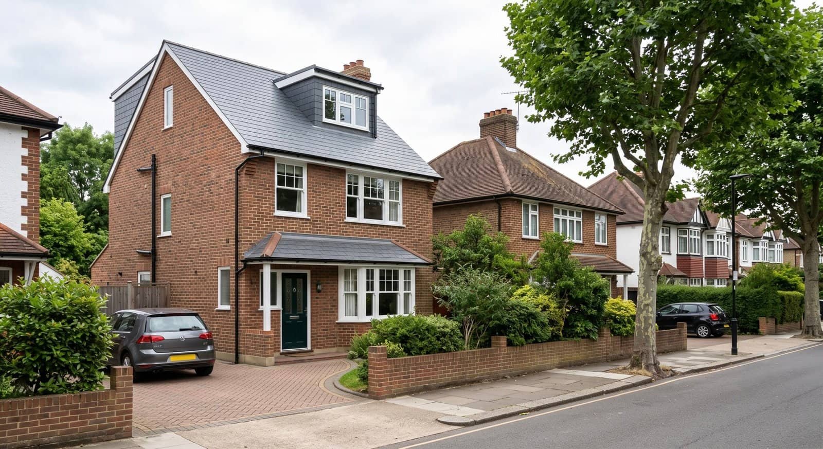 Hip to gable loft conversion on a 1930s semi-detached house, next to an unconverted hipped roof